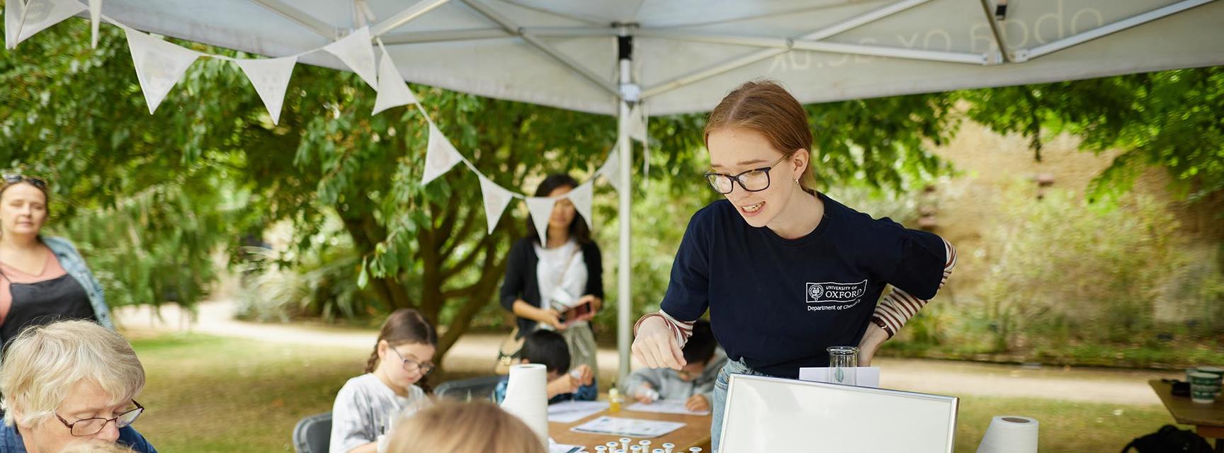 Picture showing a Chemistry Ambassador working with members of the public