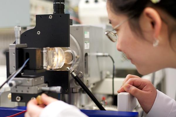 Photo of person in a laboratory undertaking research