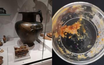 A bronze jars excavated from a 6th century BCE Greek shrine, and the orange residue it contained